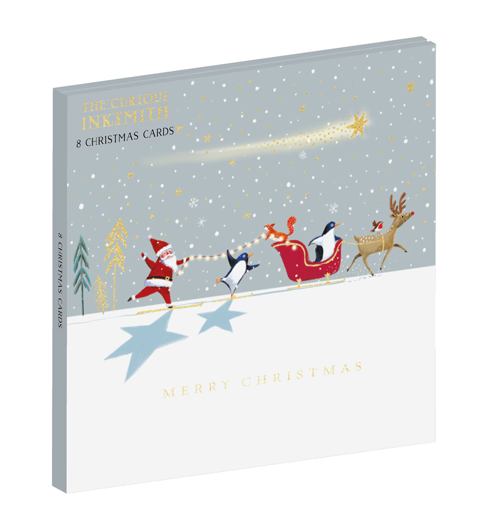 Curious Inksmith Festive Skiing Penguins with Santa Wallet of 8 Christmas Cards in 2 Designs - 12 x 12cm - Gold Embossed - Great British Card Company